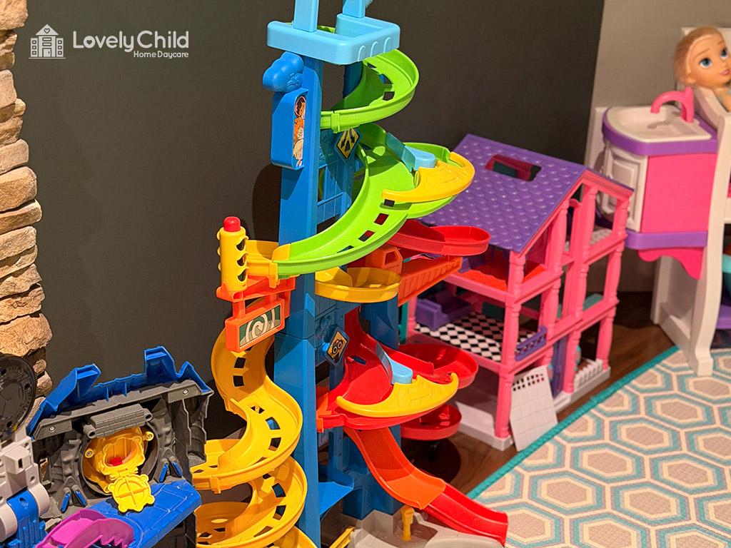 Toy playset with slides and a dollhouse