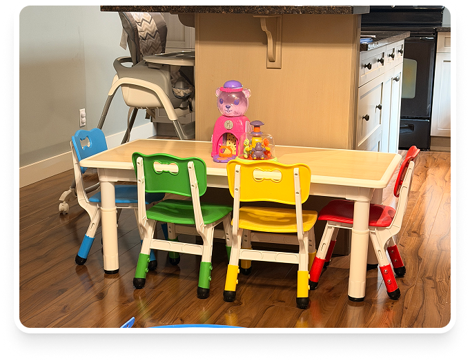 Colorful children's activity table with toys at Lovely Child Home Daycare
